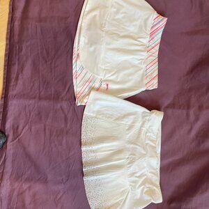 Two girls tennis skirts